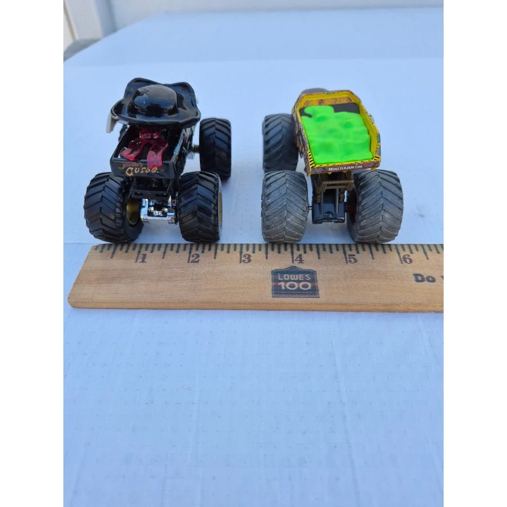 Monster Jam Pirates Curse and Zombie vs Hunter Earth Shaker Die-Cast Truck Lot